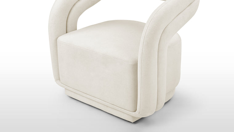 Textured Sophistication | Crafted with premium, neutral-toned fabric, this chair balances durability with a soft, inviting touch, perfectly complementing its sleek design.
