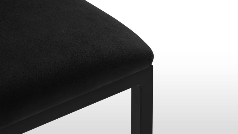 Chic and Sophisticated | Crafted with a high-density foam padded seat covered in luxurious black velvet, the stool ensures both comfort and style. The sturdy metal frame with a black finish enhances its durability and chic appearance.
