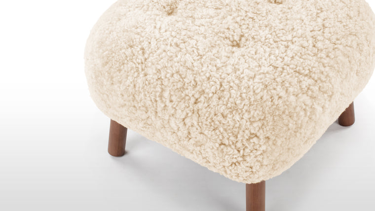 STYLISH AND VERSATILE | With a solid beech and plywood frame, the Petra is covered in HR foam and polyester wadding, and encased in Luxe Sheepskin, the Ottoman provides the ultimate cozy companion to the Lounge Chair, or as a stylish stool on its own.
