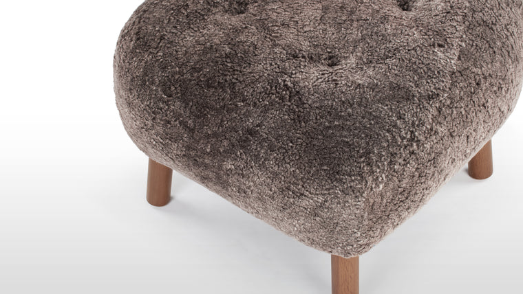 STYLISH AND VERSATILE | With a solid beech and plywood frame, the Petra is covered in HR foam and polyester wadding, and encased in Luxe Sheepskin, the Ottoman provides the ultimate cozy companion to the Lounge Chair, or as a stylish stool on its own.
