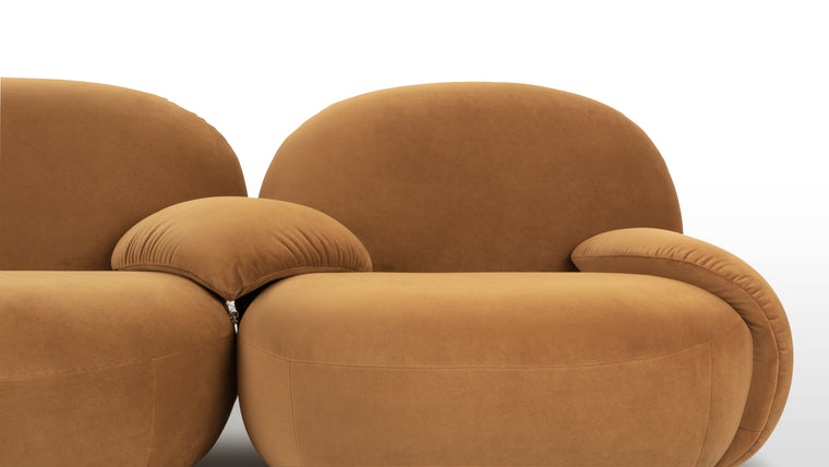 SOFT AND CURVACEOUS | Constructed with a sturdy frame and upholstered in premium materials, the Pacha Sofa exudes quality craftsmanship and enduring beauty. Its graceful curves and opulent upholstery make it a stunning focal point in any room, while its ergonomic design ensures optimal support and comfort.
