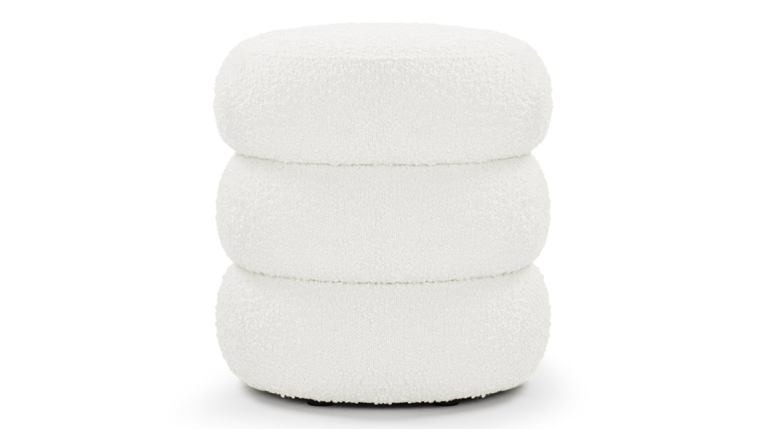 Sculptural Comfort | A statement shape in a cozy, inviting fabric, the Noa Ottoman is perfect for lounging or sitting. Its sculptural design adds a unique touch to any room.
