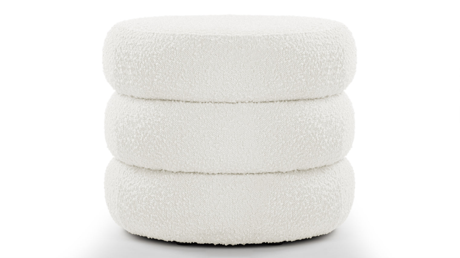 Sculptural Comfort | A statement shape in a cozy, inviting fabric, the Noa Ottoman is perfect for lounging or sitting. Its sculptural design adds a unique touch to any room.
