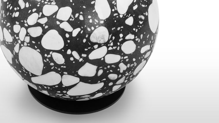 Terrazzo Pattern | The Innes Coat Stand is defined by its a solid base in a black and white terrazzo design. A black background flecked with islands of white marble with grey veining, the rounded shapes of the offcuts perfectly suit to the spherical base.
