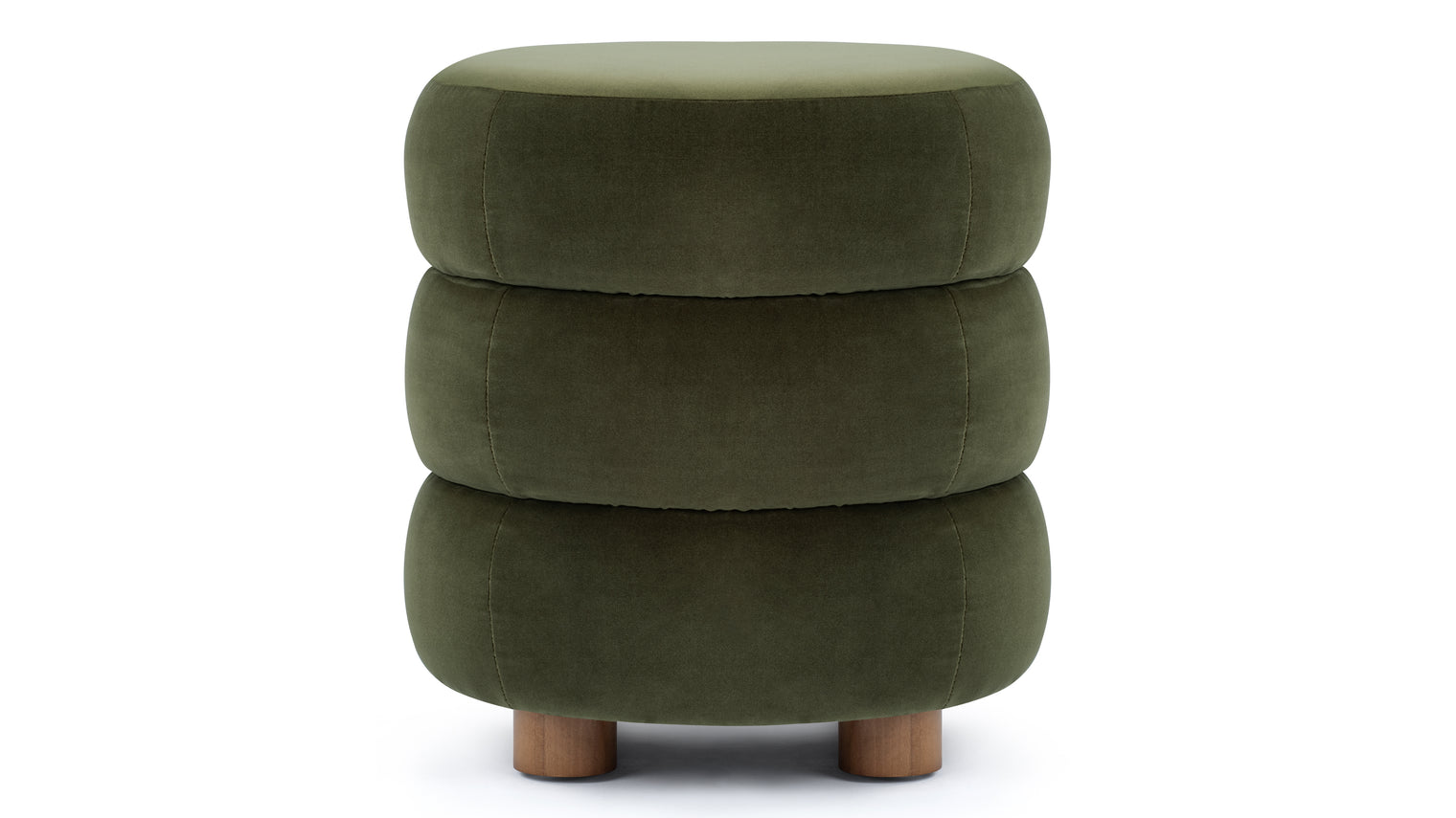 Organic Shape and Sophistication | A statement piece that effortlessly elevates any suite. The Niner Ottoman exudes a contemporary aesthetic with its undulating, rounded shape and lush green velvet, offering a perfect blend of modern sophistication and organic warmth. 
