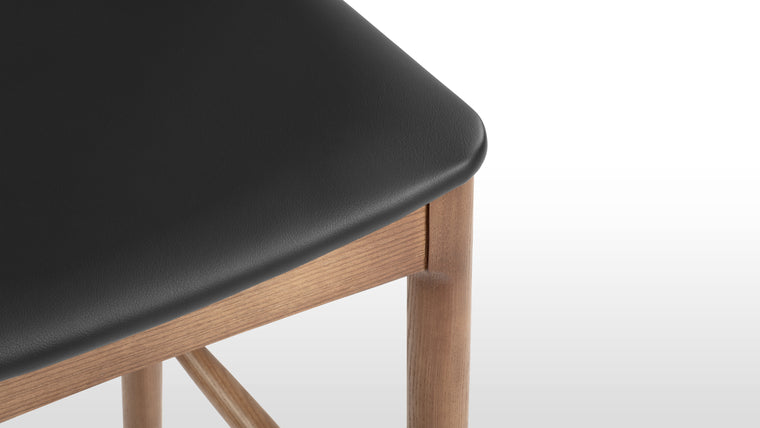 PERFECTLY PRACTICAL | Courtesy of its minimalist silhouette and smart design, the Elbow Counter Stool is lightweight small space friendly. Change up your dining and office space effortlessly with this chic seat.
