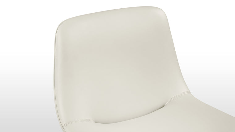 Enduring Comfort | Ergonomically curved for full body support and padded for long-lasting comfort, the design's versatile forms—side chair, armchair, or stool—make it an adaptable piece for various spaces.
