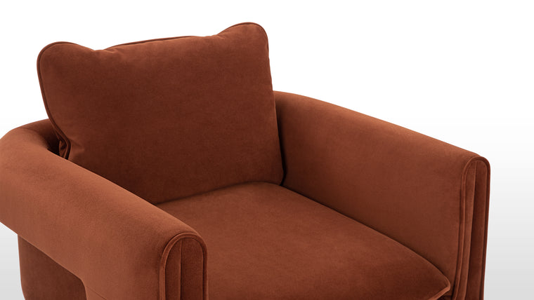 Style for the Ages | Wrapped in sumptuous burnt orange velvet, this armchair promises luxurious comfort. The soft padding and adaptable backrest offer a perfect blend of style and lasting quality.
