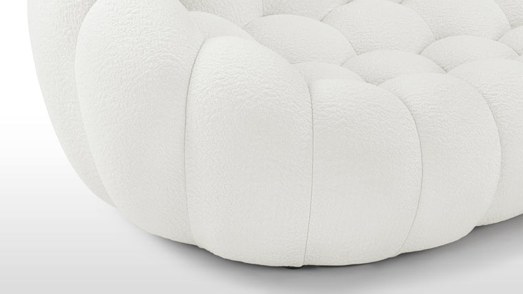 CURVACEOUS COMFORT | The innovative upholstery truly sets the Bubble Sofa apart. Available in a knit jersey fabric with a unique texture that enhances the sofa's aesthetic appeal and tactile sensation.
