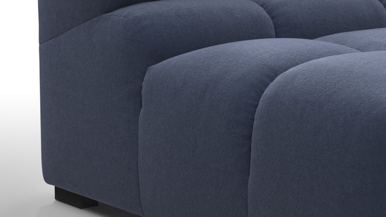 SUPERIOR COMFORT | Designed with the easy-going, informal ethos of the 1970s in mind, the Tufted modules are generously proportioned, coming together in a bench-like base with barely-there connections, allowing plenty of room for you to lean back and curl up in comfort.
