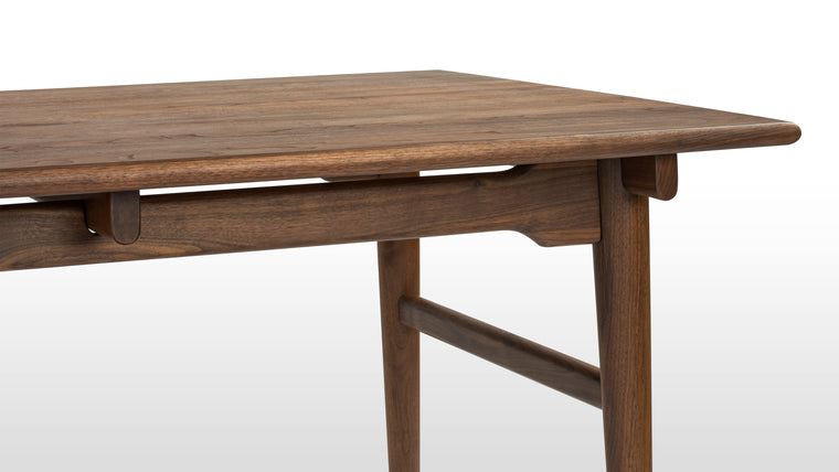 Made to Last | Combining expert craftsmanship and quality materials, this dining table promises longevity. It’s made of solid ash for durability and boasts tapered legs connected by cross stretchers for added stability at its base.
