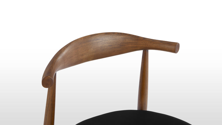 IN THE ROUND | The rounded backrest of this chair is masterfully steam-bent from a single piece of wood, giving you plenty of back support.
