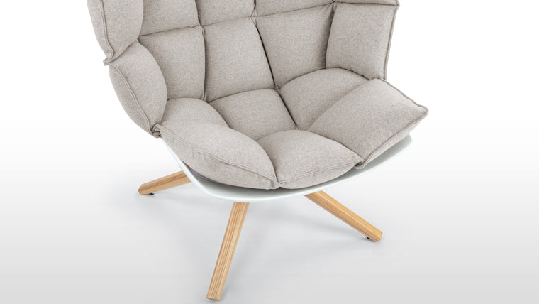 Cocooned Comfort | Thoughtfully designed to cradle the body, this lounge chair offers ergonomic support through its padded, molded structure. It seamlessly balances style and relaxation, perfect for unwinding or reading.
