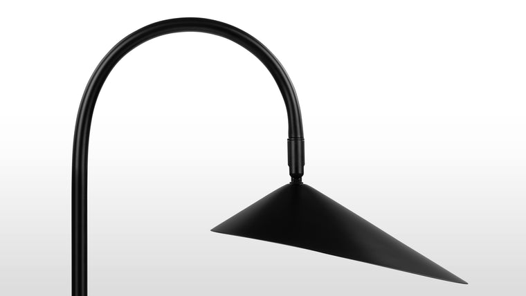 Stability and Style | Practicality and functionality are hallmarks of the Arum Table Lamp. The stone base provides stability, ensuring the lamp remains securely in place. The angle of the shade is easily adjustable, accommodating various activities such as reading, working, or simply adding a soft glow to the room.
