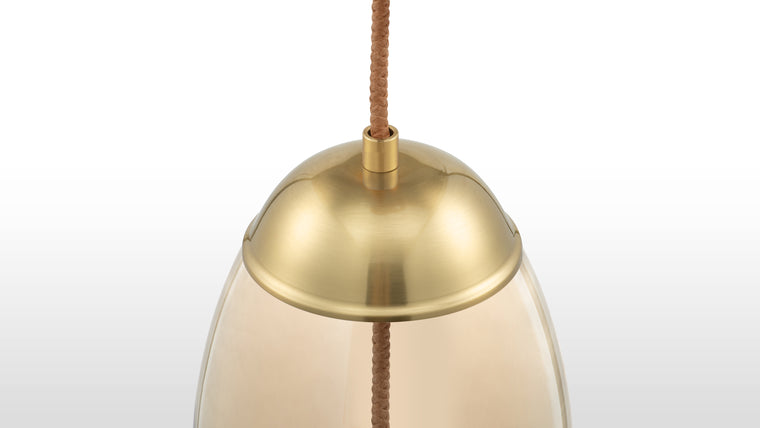 Refined Craftsmanship | This pendant is crafted from high-quality materials, featuring a gentle amber-colored glass, durable iron fittings with a brass finish, and unique rope detailing for added texture.
