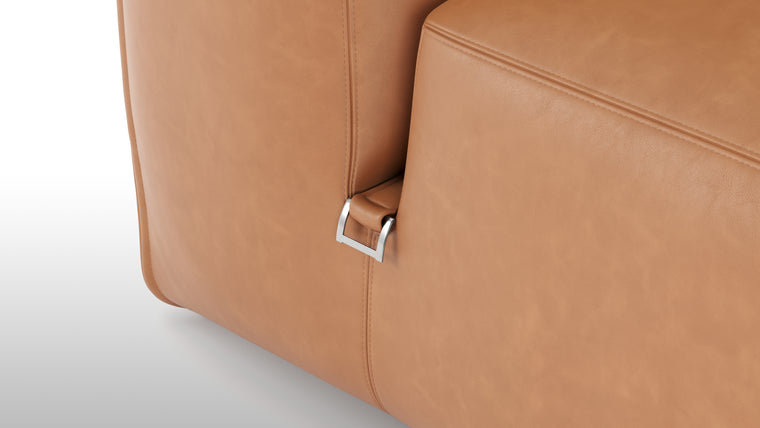 Premium Texture | Available in both neutral-toned fabric and leather or vegan suede, the collection features a foam interior for deep comfort, with understated wooden legs and sleek metal buckles for easy configuration.
