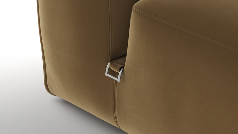 Premium Texture | Available in both neutral-toned fabric and leather or vegan suede, the collection features a foam interior for deep comfort, with understated wooden legs and sleek metal buckles for easy configuration.
