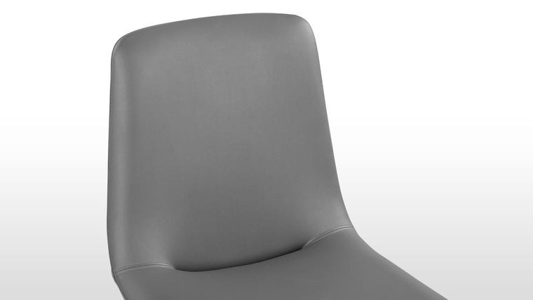 Enduring Comfort | Ergonomically curved for full body support and padded for long-lasting comfort, the design's versatile forms—side chair, armchair, or stool—make it an adaptable piece for various spaces.
