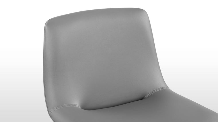 Enduring Comfort | Ergonomically curved for full body support and padded for long-lasting comfort, the design's versatile forms—side chair, armchair, or stool—make it an adaptable piece for various spaces.
