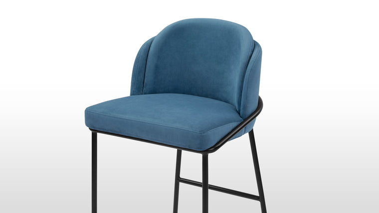 Stylish Comfort | The widely curved back encourages reclining, promising comfort through hours of sitting. With a smooth seat and a backrest that features an additional padded section, the Aben Counter Stool offers increased support.
