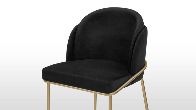 Stylish Comfort | The widely curved back encourages reclining, promising comfort through hours of sitting. With a smooth seat and a backrest that features an additional padded section, the Aben Dining Chair offers increased support.
