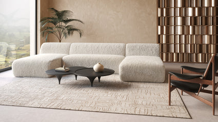 Luxe Comfort | The Iona Sectional Collection is the epitome of modern luxury and comfort, offering a sophisticated seating solution for contemporary homes. Upholstered in a plush, faux sheepskin fabric, it exudes warmth and indulgence while providing a cozy lounging experience.