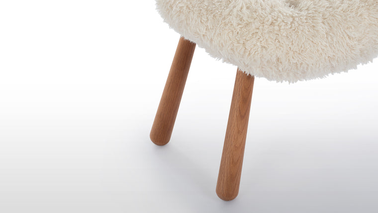 NORDIC DETAILS | Playfully named because of its resemblance to a shell, the Clam Ottoman’s simple, playful form pays homage to Scandinavian design in its honest, understated use of European hardwood and plush upholstery.
