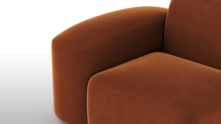 Warm Minimalism | Minimalist yet striking, the modules feature soft velvet upholstery, chunky arms, rounded edges, and detailed stitchwork for tactile and visual intrigue. The burnt orange hue adds a touch of warmth and timeless sophistication.
