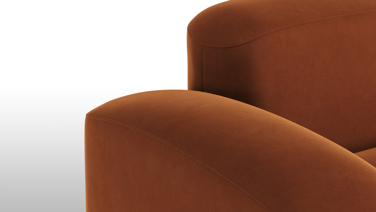 Warm Minimalism | Minimalist yet striking, the modules feature soft velvet upholstery, chunky arms, rounded edges, and detailed stitchwork for tactile and visual intrigue. The burnt orange hue adds a touch of warmth and timeless sophistication.
