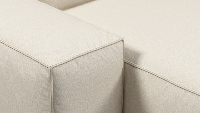 Durable Modernity | Featuring a boxy silhouette with deep seating, the collection is wrapped in neutral beige outdoor fabric and supported by a sleek, aluminum frame—blending modern design with durable materials.
