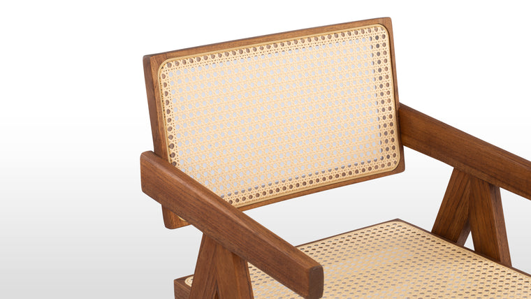 BUILT TO LAST | A solid teak frame with angled legs and tapered armrests ensures both stability and comfort, while the weather-resistant rattan seat and back provide breathable support—perfect for open-air relaxation.
