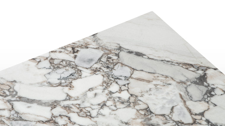 Earthen Elegance | Crafted from exquisite natural stone, each slab is a testament to the beauty of the earth's raw materials, showcasing unique veining and textures that add depth and character to every mealtime experience.
