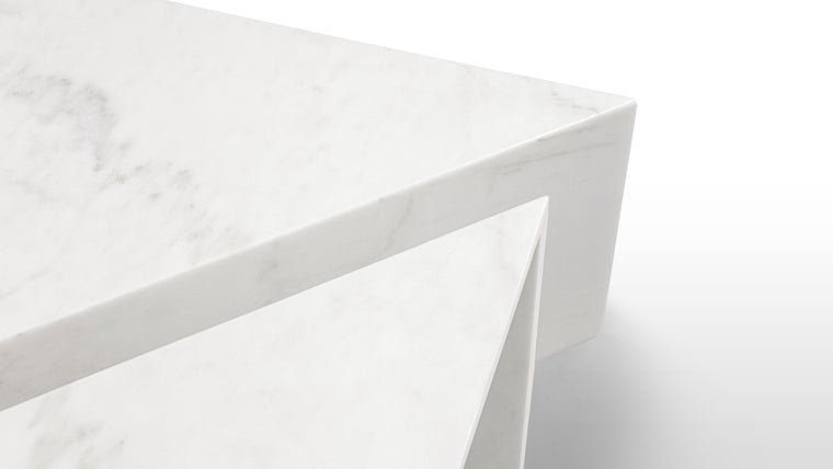 Luxe Marble | Crafted from elegant white marble, this minimalist coffee table set pays homage to its high-end materials with its simple form. The large table tops showcase the subtle gray veining and natural depth that make marble such a beautiful, sought-after material.
